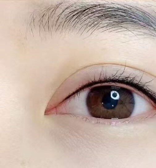 The same eye after the work: definition set into the lash line, densest at the base of the lashes.