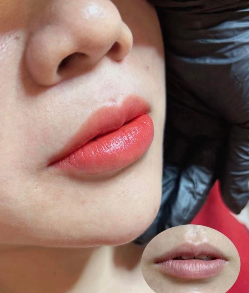 After: warm coral-red lips, the artist's gloved fingers in frame. The small round photo at the bottom shows the lips before: light, even pink with a lilac cast.